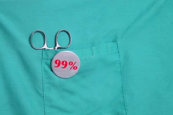 Nittio procent knappen på gröna scrub — Stockfoto