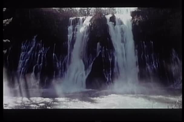 Water flowing down waterfalls in slow motion — Stock Video