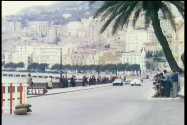 Cars racing along coast line — Stock Video