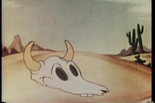 Cartoon of eyes popping out of cow skull in the desert — Stock Video ©  everett225 #26625705