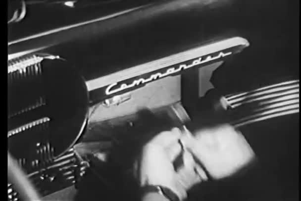 Close-up of man hiding gun in glove compartment of Studebacker Commander — Stock Video