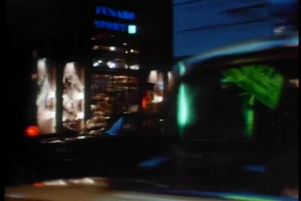 Вид фасадів магазинів з автомобіля, що рухається — стокове відео