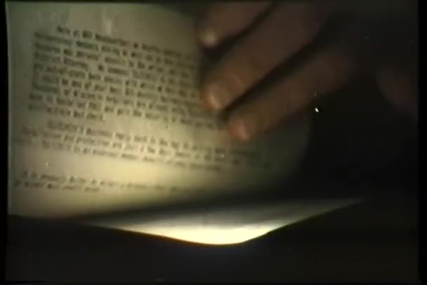 Close-up of hand searching through papers — Stock Video
