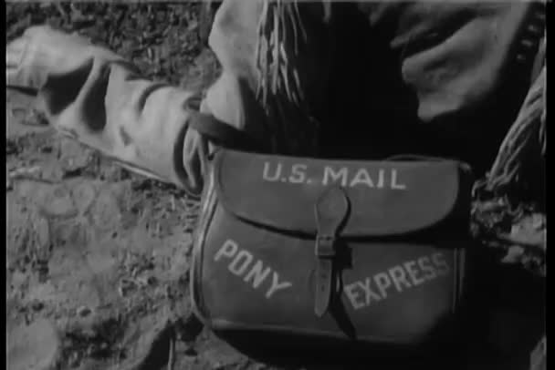 Close-up of U.S. mail bag attached to arm of dead man — Stock Video