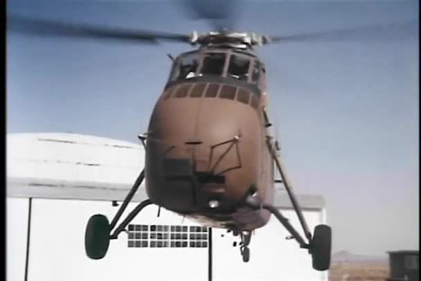 Military helicopter landing on helipad — Stock Video