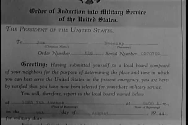 Close-up of 1944 notice of induction into military service — Stock Video