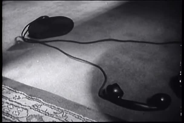 Telephone receiver lying on floor — Stock Video