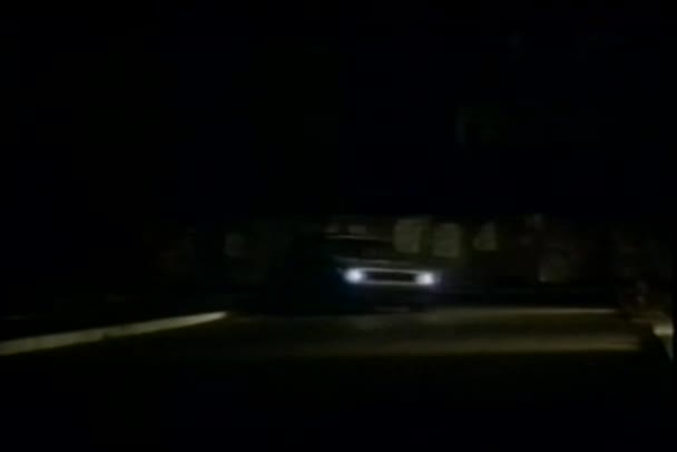 Car chased by pickup truck at night — Stock Video