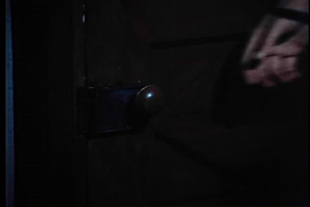Close-up of man forcing door lock open — Stock Video