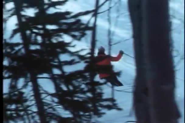 Rear view of ski patrol skiing on slope — Stock Video