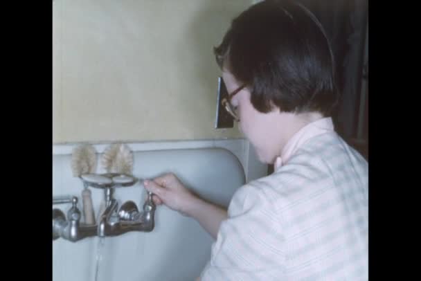 Woman washing hands in the sink — Stok video