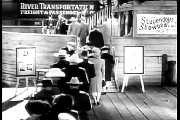 Rear view of passengers boarding showboat — Stock Video
