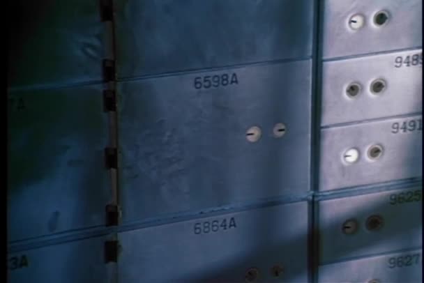 Close-up of safe deposit boxes in a bank vault — Stock Video