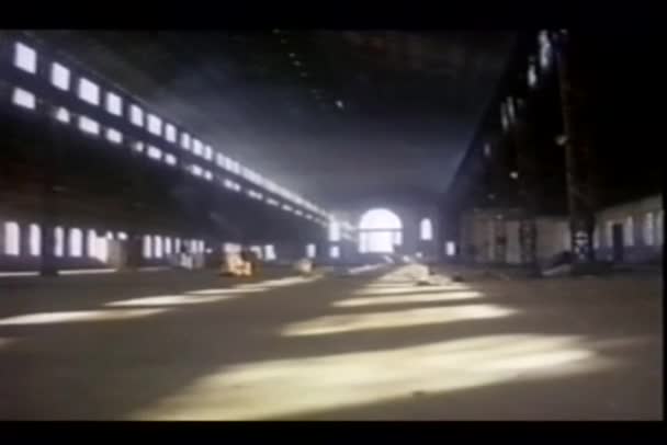 Tracking shot of abandoned airplane hangar — Stock Video