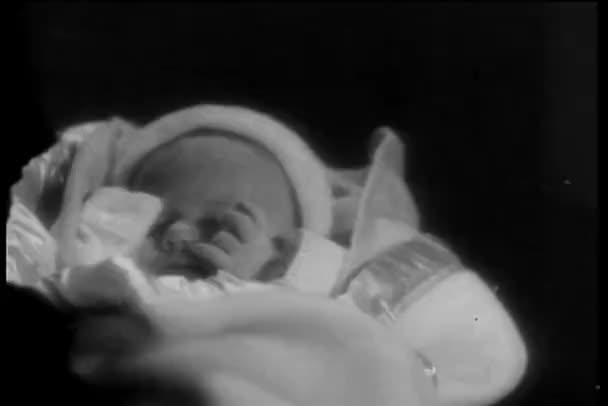 Close-up of infant wrapped in blanket — Stock Video