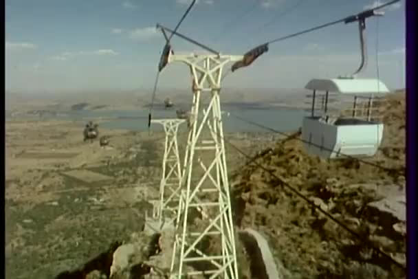 Helicopters flying by cable car — Stock Video