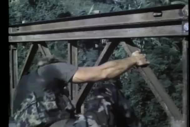 Soldier jumping off bridge as it blows up — Stock Video