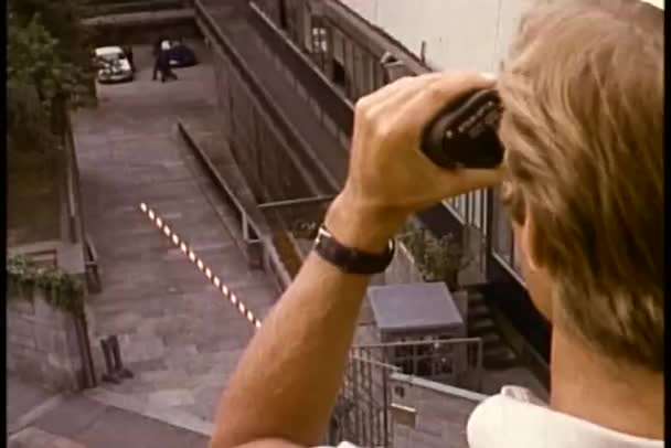 Man looking through binoculars — Stock Video