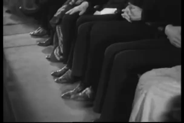 Row of stamping their feet in time to the music — Stock video
