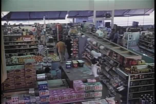 High angle view of security guard walking through store — Stock Video