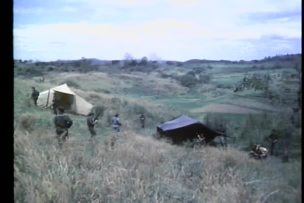 Soldiers patroling hillside Army camp — Stock Video