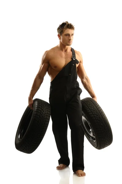 Man with tires — Stock Photo, Image