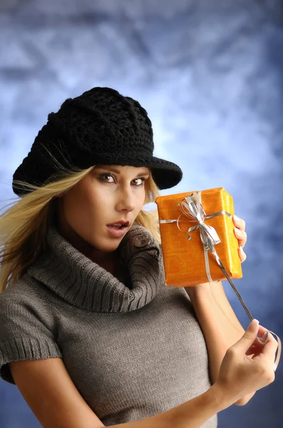 Blond girl with a gift — Stock Photo, Image