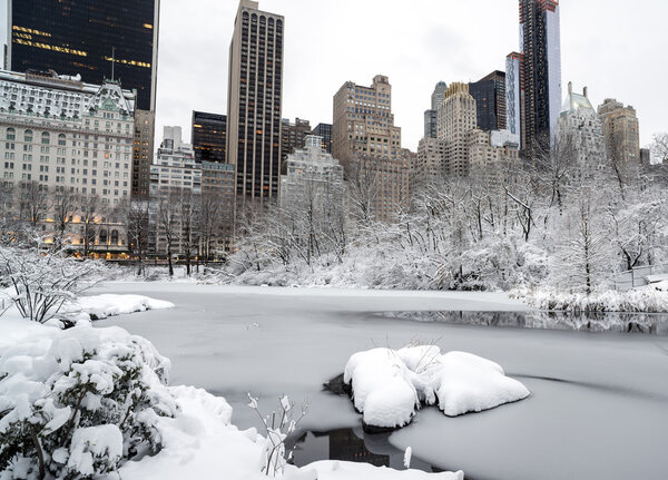 Central after snow storm with view of Plaza hotel