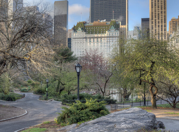 Central Park in spring with cherry and crab apple trees in bloom Plaza Hotel