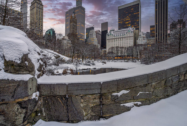 Gapstow Bridge in Central Park after snow storm, at sunrise, morning