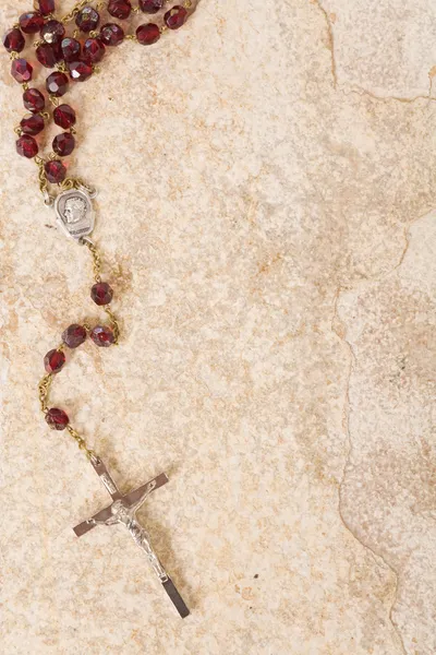 Rosary beads on stone with copy space — Stock Photo, Image