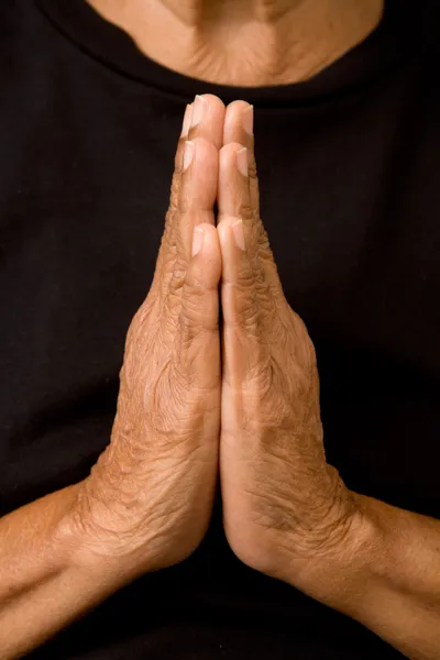 Old woman praying — Stock Photo, Image
