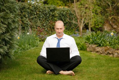 Businessman working outdoors clipart