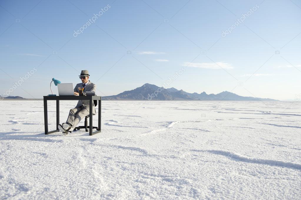 Businessman Working on Inspiration at Desk Outdoors
