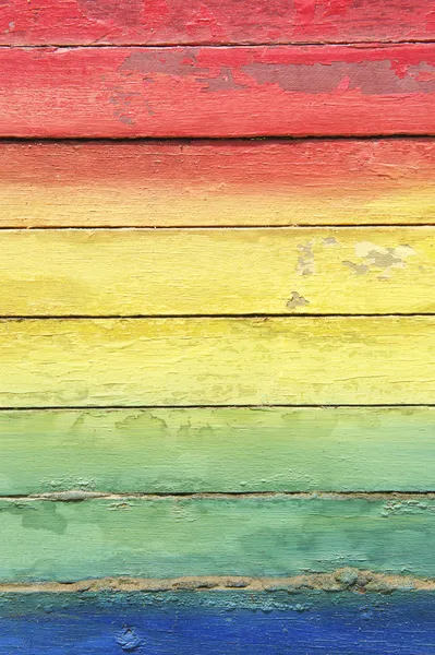 Colores del arco iris pintados en madera envejecida — Foto de Stock