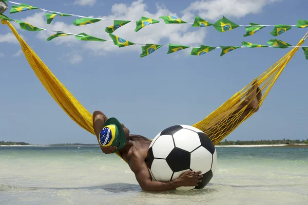 Brazilian Relaxing with Soccer Football in Beach Hammock — Stock Photo, Image