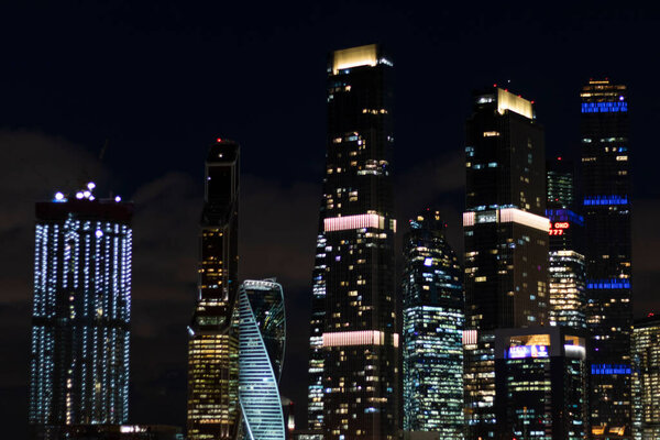 Night city skyscrapers business center traffic transport lights urban vibe concept wallpaper
