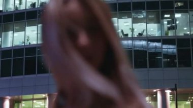 beautiful young girl blonde walks around the night city