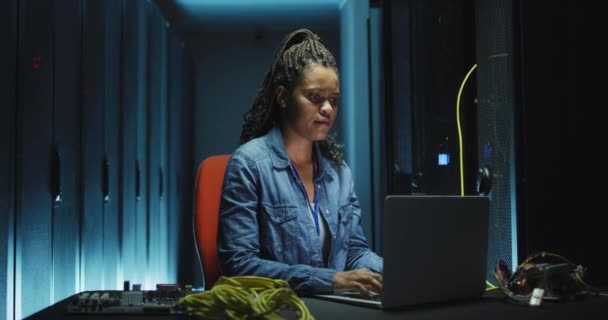 African American Female Computer Technician Using Laptop Working Business Server — Stock Video