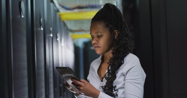 African American Female Computer Technician Using Tablet Working Business Server — Stock Video