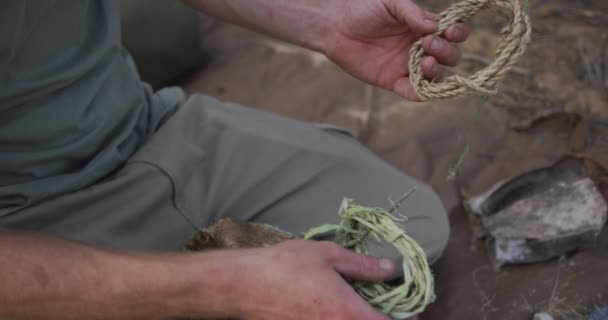 Caucasian Male Survivalist Preparing Tinder Twine Make Fire Camp Wilderness — Stock Video
