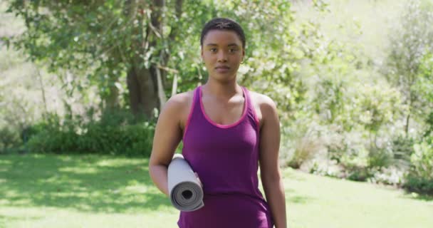 Portrait Biracial Woman Holding Yoga Mat Laughing Garden Sunny Day — Stock Video