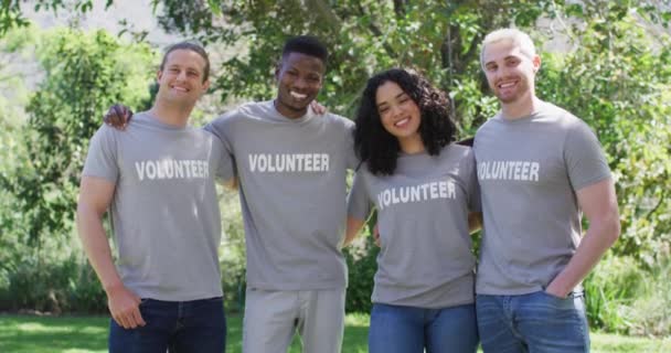 Portrait Smiling Diverse Group Happy Friends Volunteer Shirts Embracing Outdoors — Stock Video