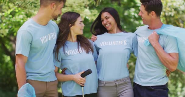 Portrait Smiling Diverse Group Friends Volunteer Blue Shirts Rubbish Collecting — Stock Video