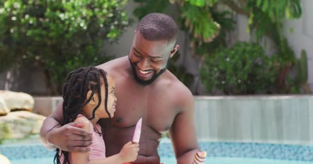 Happy African American Father Daughter Eating Ice Creams Embracing Swimming — Stock Video