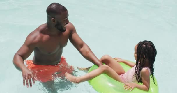 Happy African American Father Daughter Having Fun Swimming Pool Inflatable — Stock Video