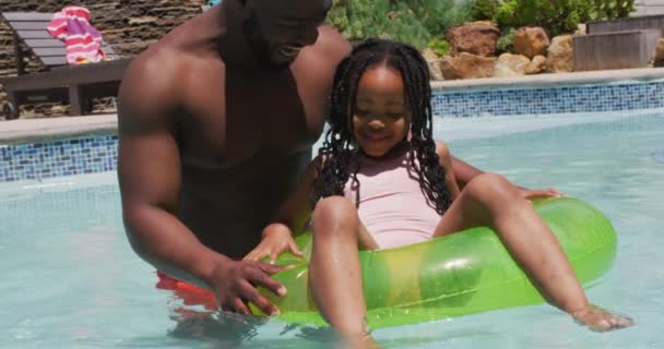Happy African American Father Daughter Having Fun Swimming Pool Inflatable — Stock Video