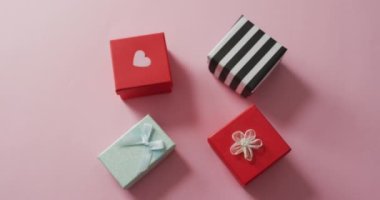Gifts with heart on pink background at valentine's day. valentine's day, love and celebration concept.