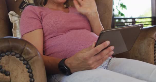 Midsection Caucasian Pregnant Woman Sitting Armchair Having Video Call Tablet — Vídeo de stock