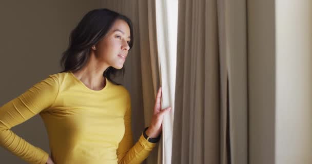 Curious Biracial Woman Revealing Curtains Looking Window Spending Leisure Quality — Stock Video